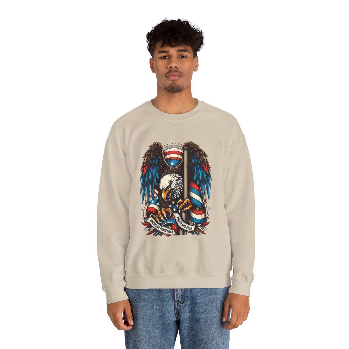 Man wearing a beige sweatshirt with an American eagle design.