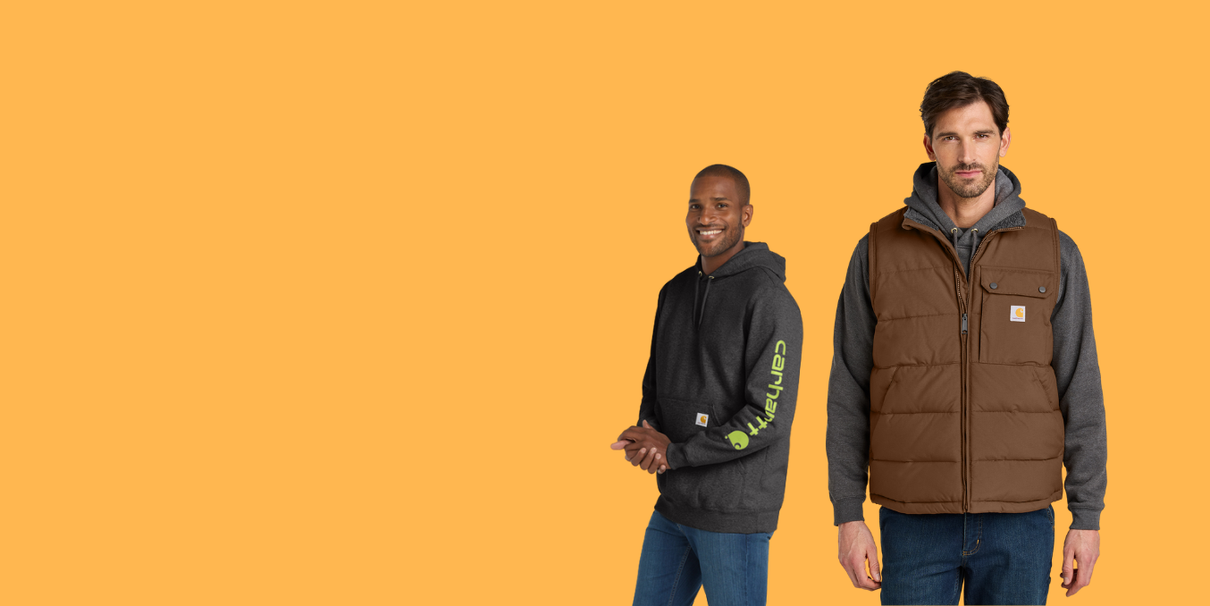 Two men wearing casual clothing, including a vest and hoodie, on an orange background.
