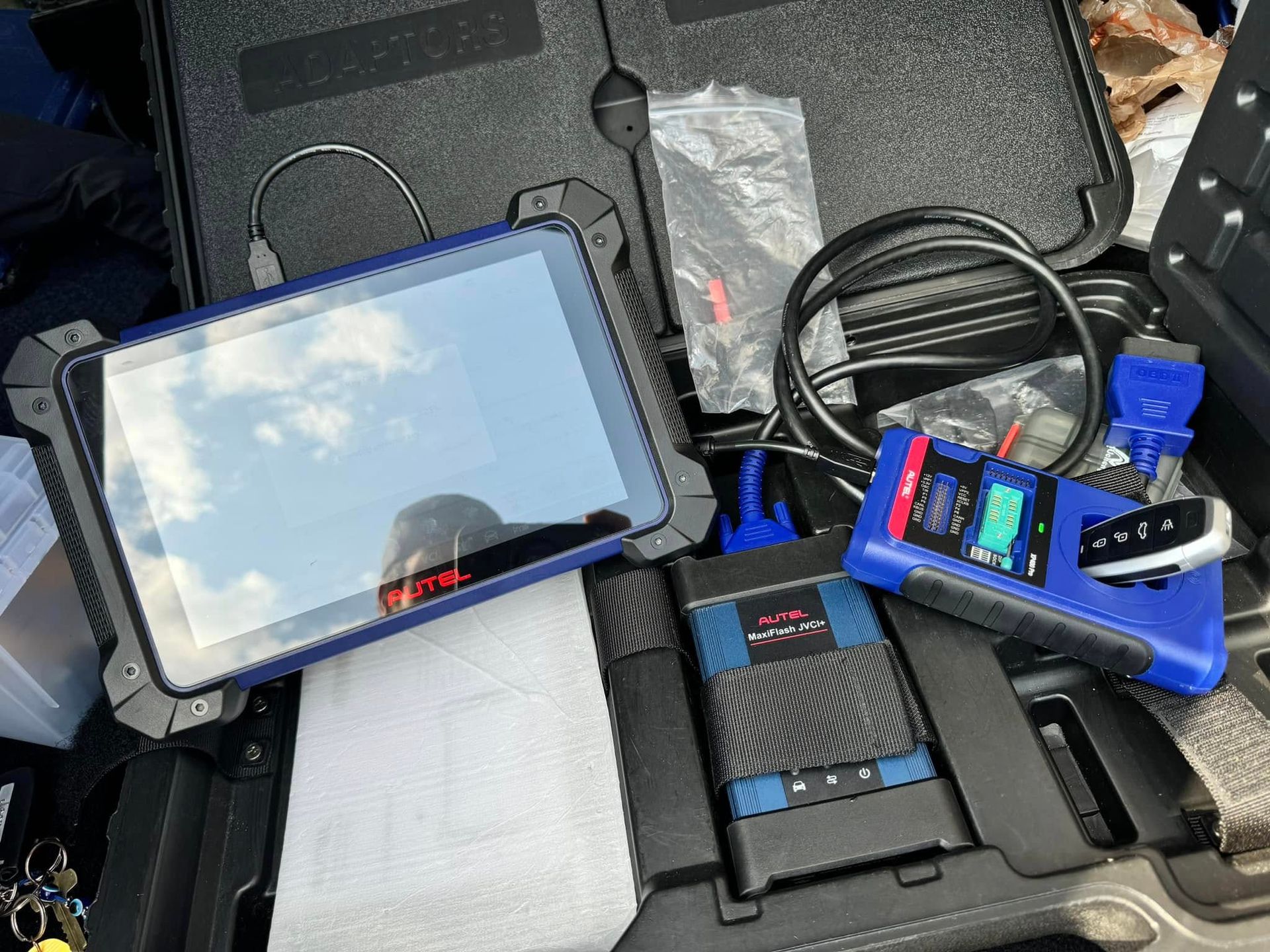A blue tablet is sitting on top of a black case.