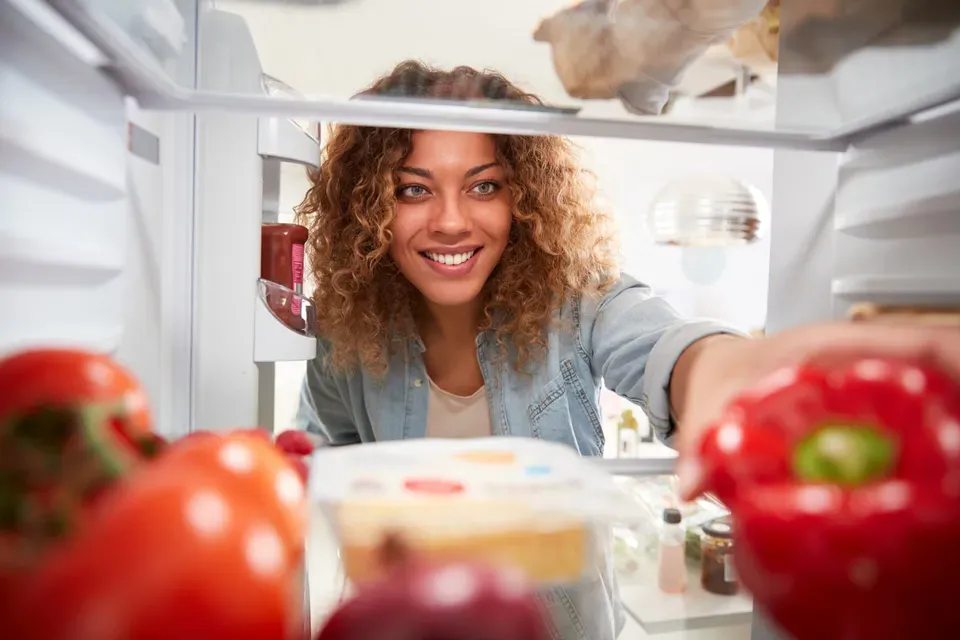 Girl Getting Some Food Inside the Refrigerator – El Paso, TX – A M Refrigeration