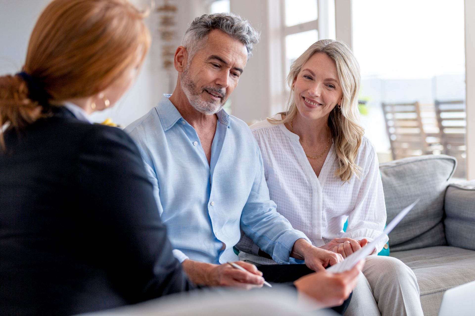 An estate planning lawyer from The Bone Law Firm is with two clients in The Villages, FL.