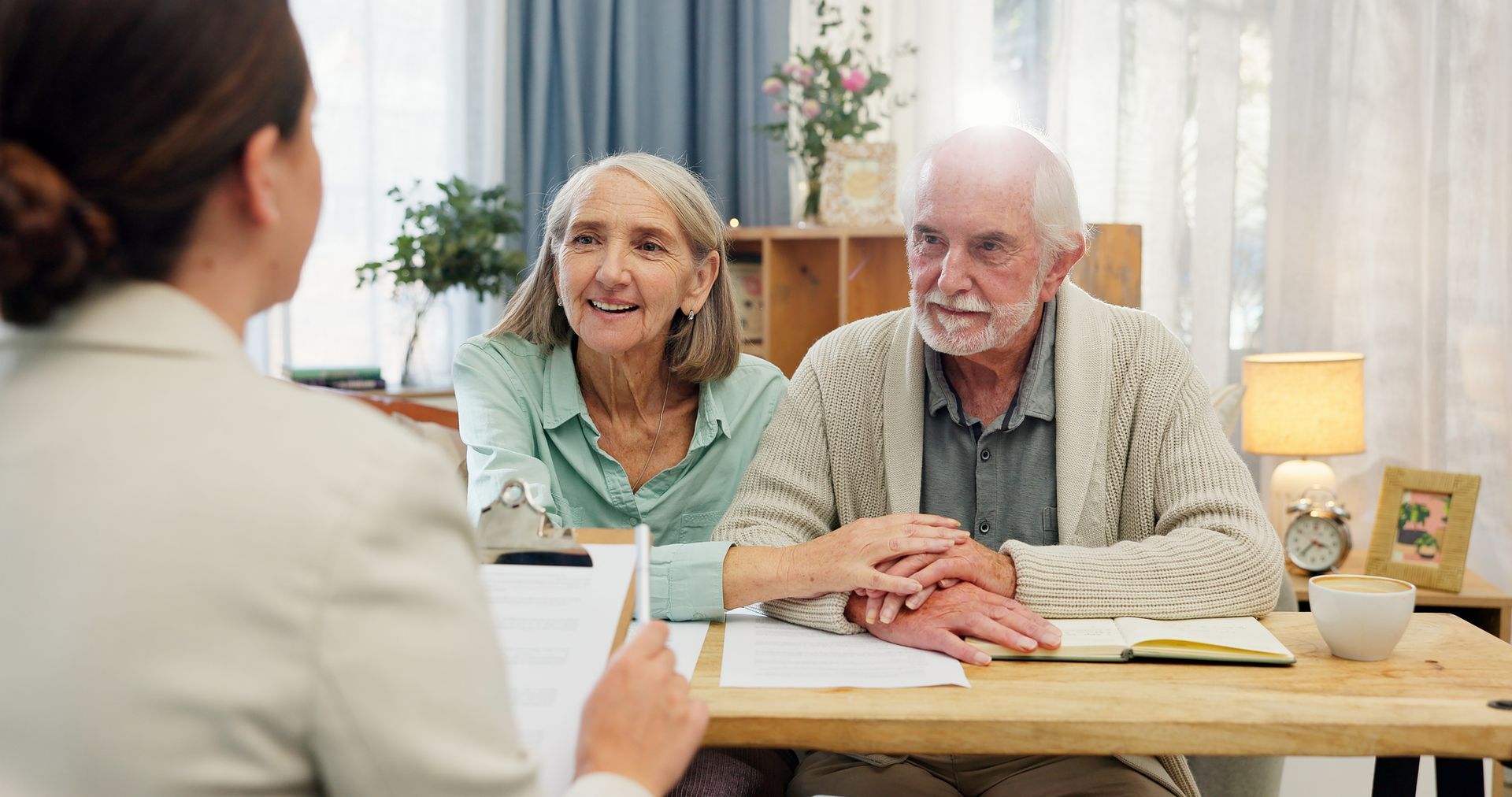 An old couple is talking about their estate planning with a lawyer.