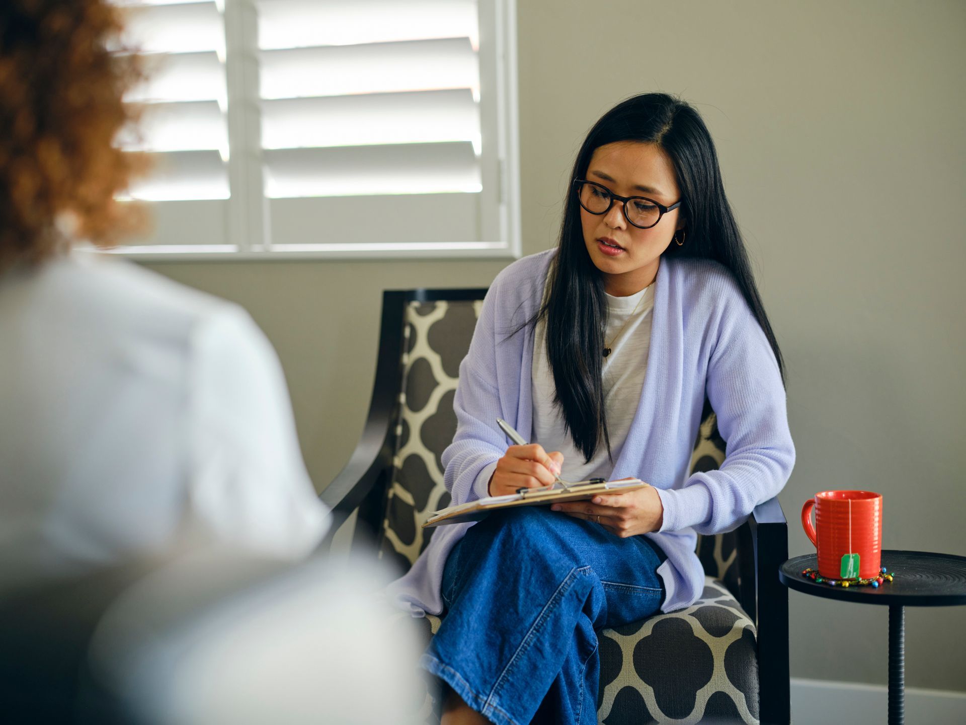 Young person in a focused therapy session with a counsellor. Young person in a focused therapy session with a counsellor.