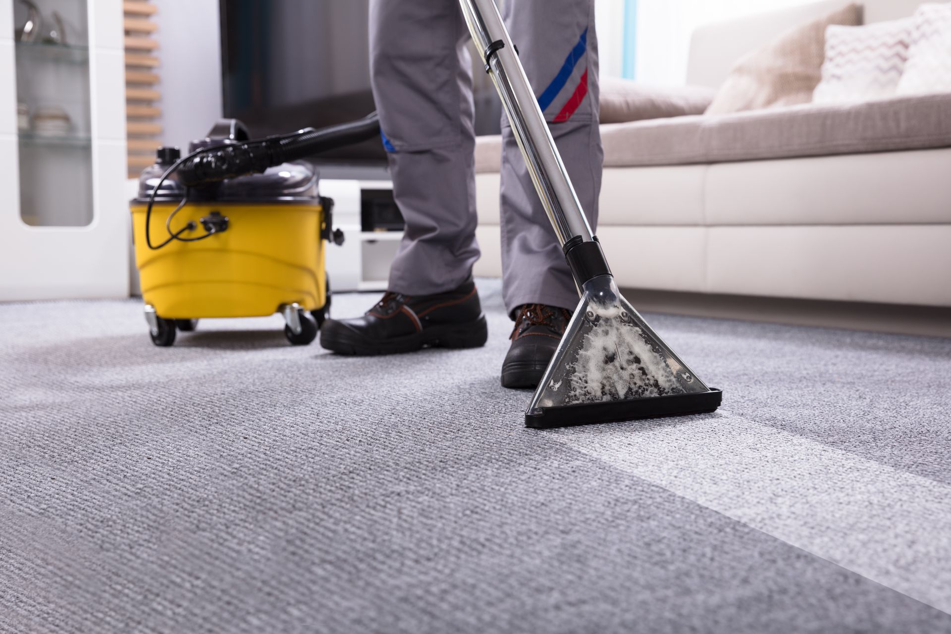 Man Cleaning Carpet With Vacuum Cleaner — Easthampton, MA — Advanced Carpet & Upholstery Cleaning