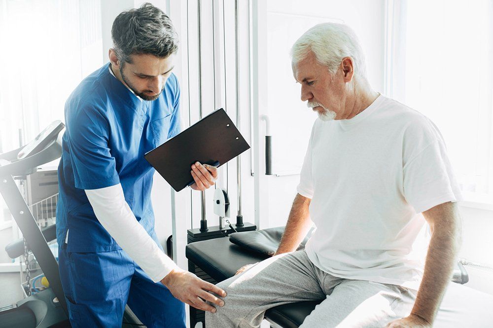 Nurse Checking Patient Knees — DFW, TX — Texas Non-Surgical Orthopedic