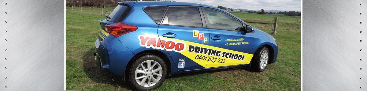 yahoo driving school name painted on car