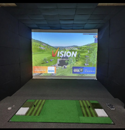 A golf simulator with a screen that says vision