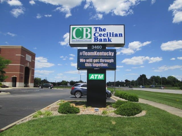 Sign for The Cecilian Bank, Kentucky, with the #TeamKentucky hashtag and ATM.
