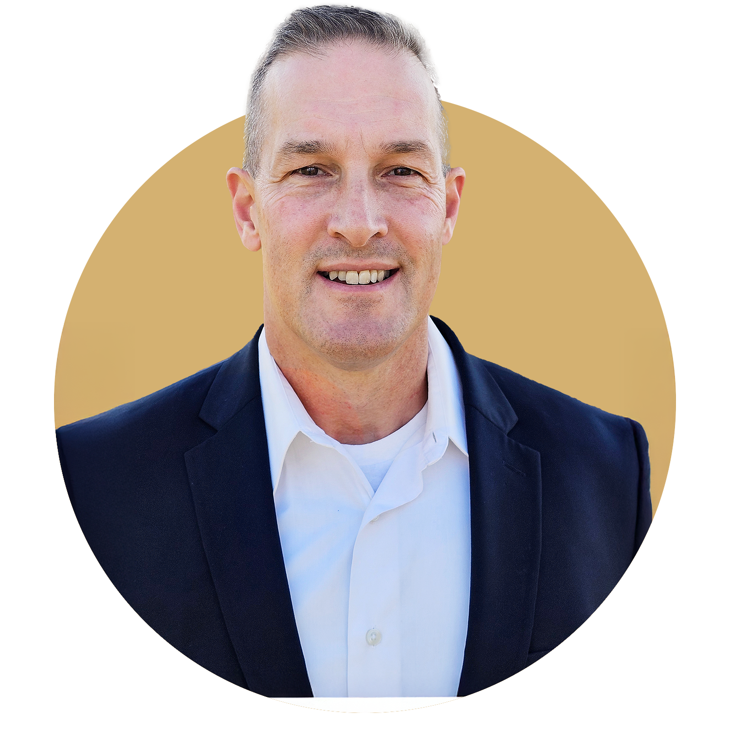 A man in a suit and tie is smiling for the camera.