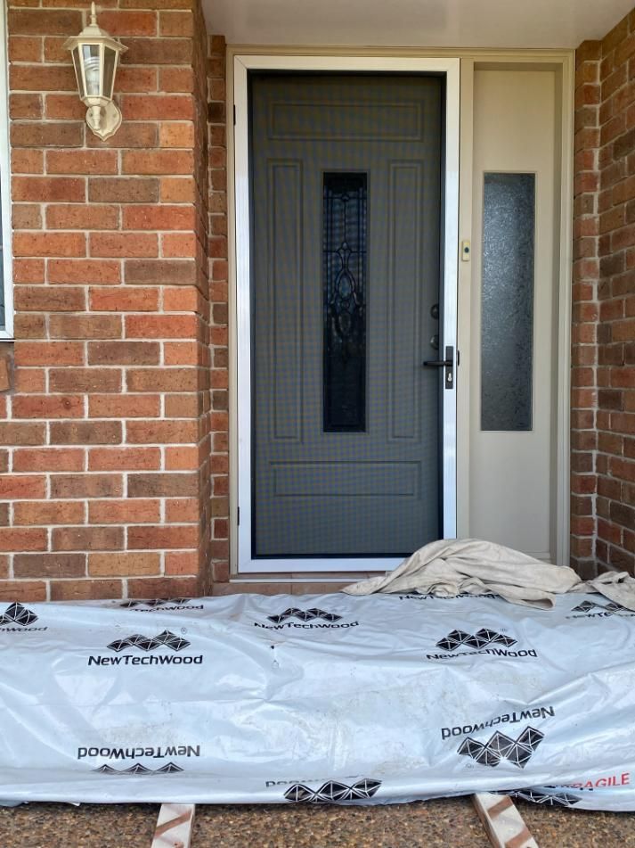 A Gray Door Is Sitting on Top of A Piece of Plastic — Midges No More in Taree, NSW