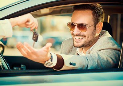 Man smiles when he rent a car — Car Rentals in Lantana, FL