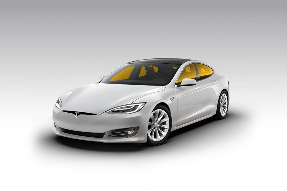 White Tesla sedan with yellow-tinted windows on a white background.
