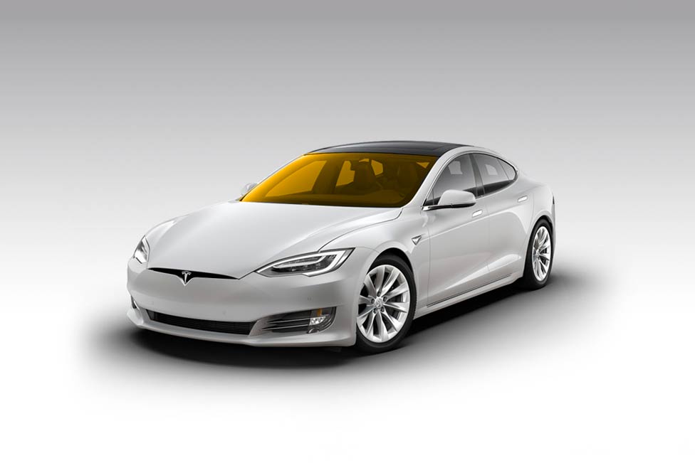 White Tesla Model S electric car with yellow tinted windows.