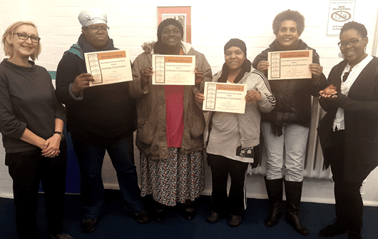 Course participants receiving certificates