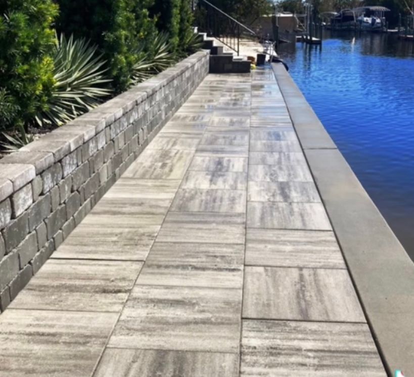 A picture of a walkway next to a body of water with the caption after