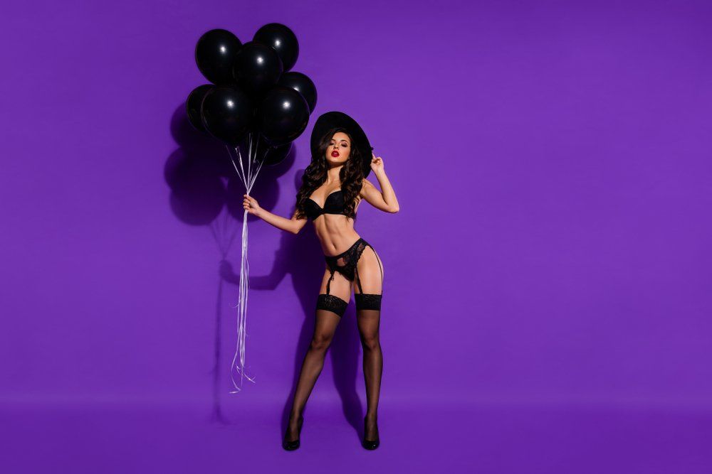 Sexy Lady Brunette Holding  Balloons — Delicious Entertainment In Mackay, QLD