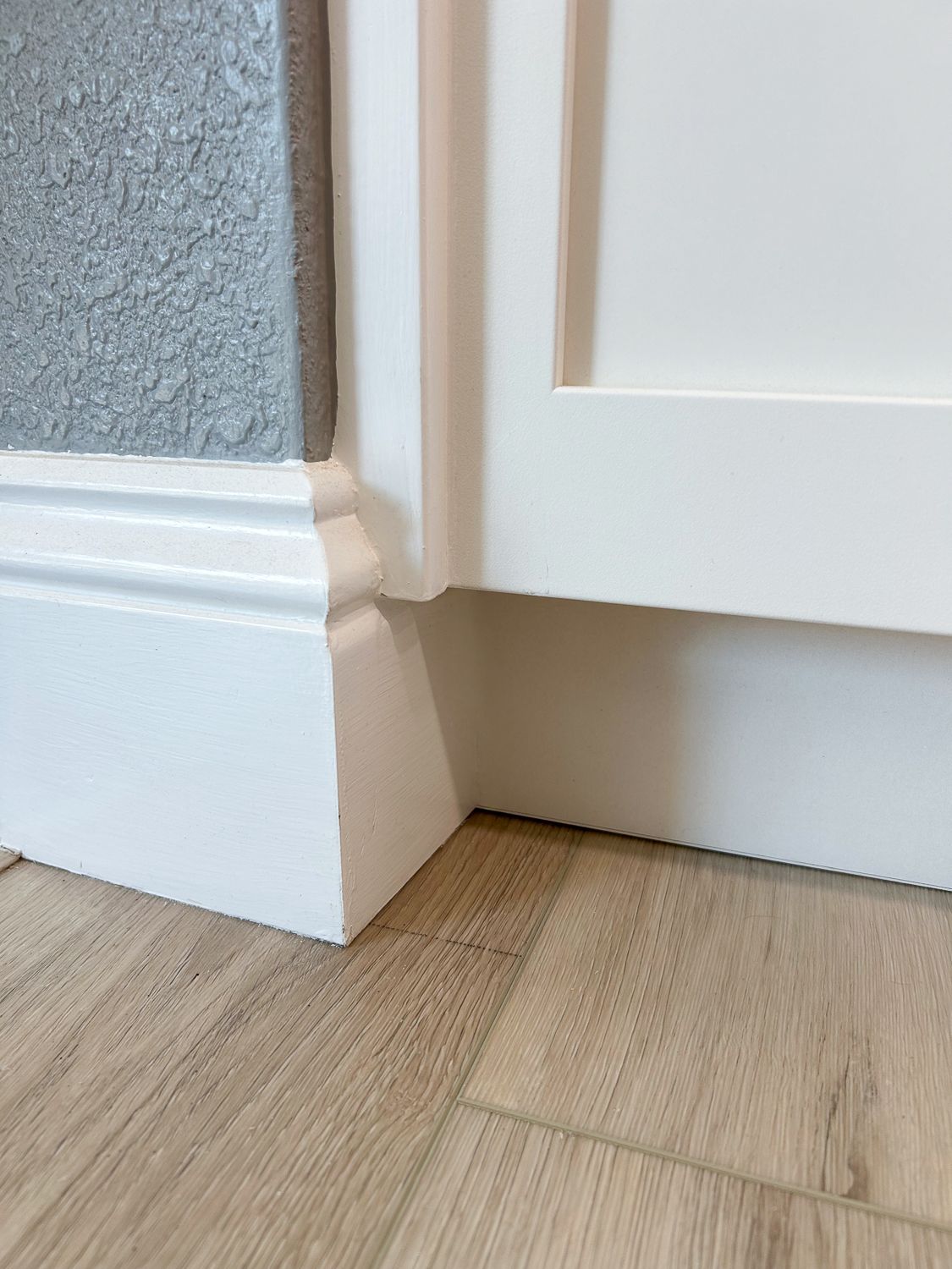 White baseboard and cabinet detail with attention to detail.