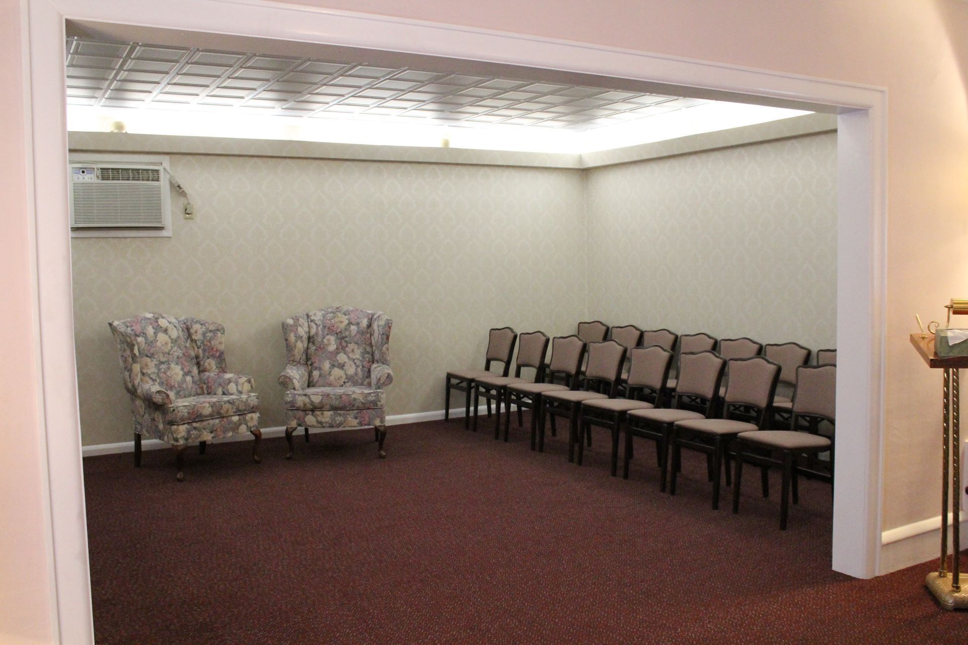 A room with chairs and a podium in it