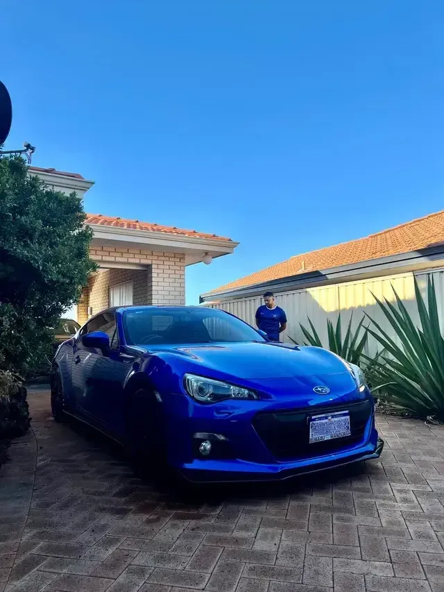 Man inspecting a car