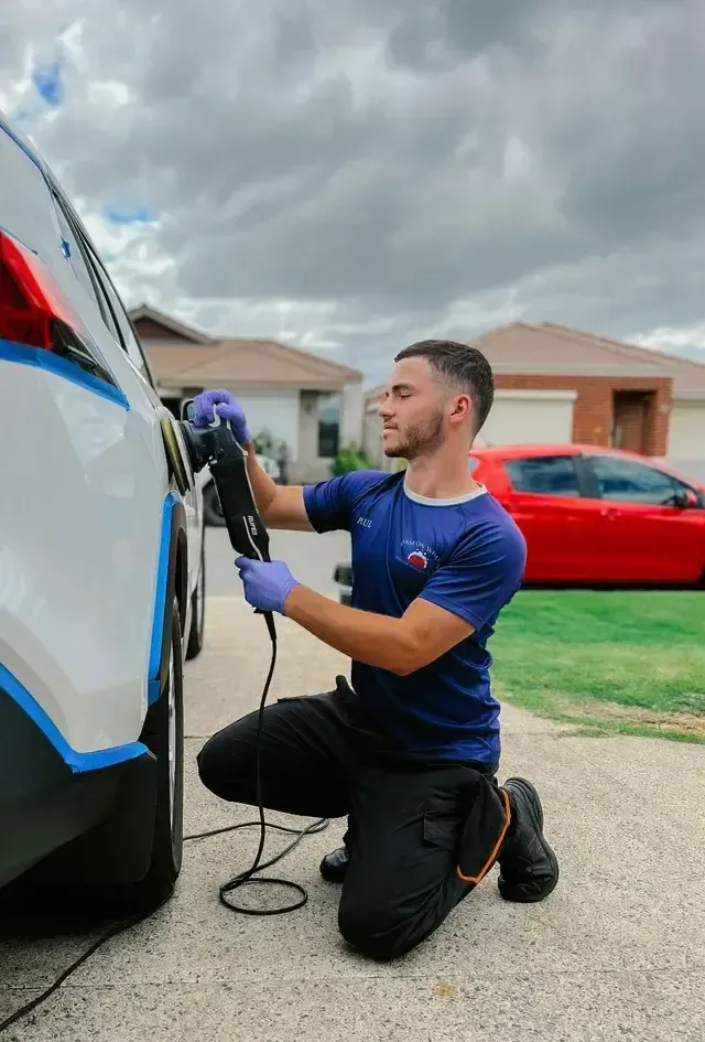 Man polising a car