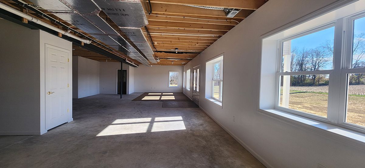 basement with windows and door