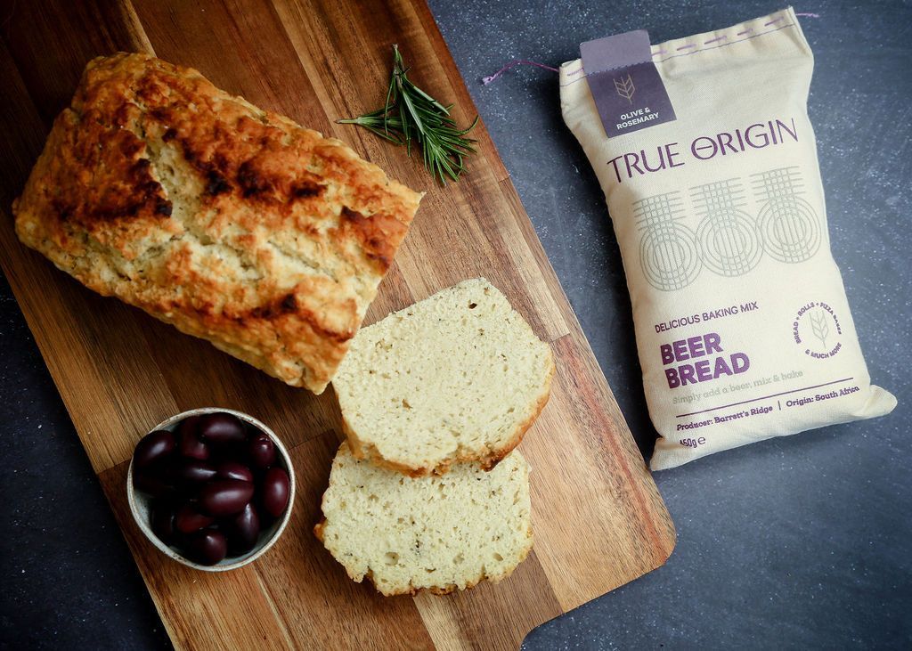Photo of some freshly baked Olive & Rosemary Beer Bread cut into slices