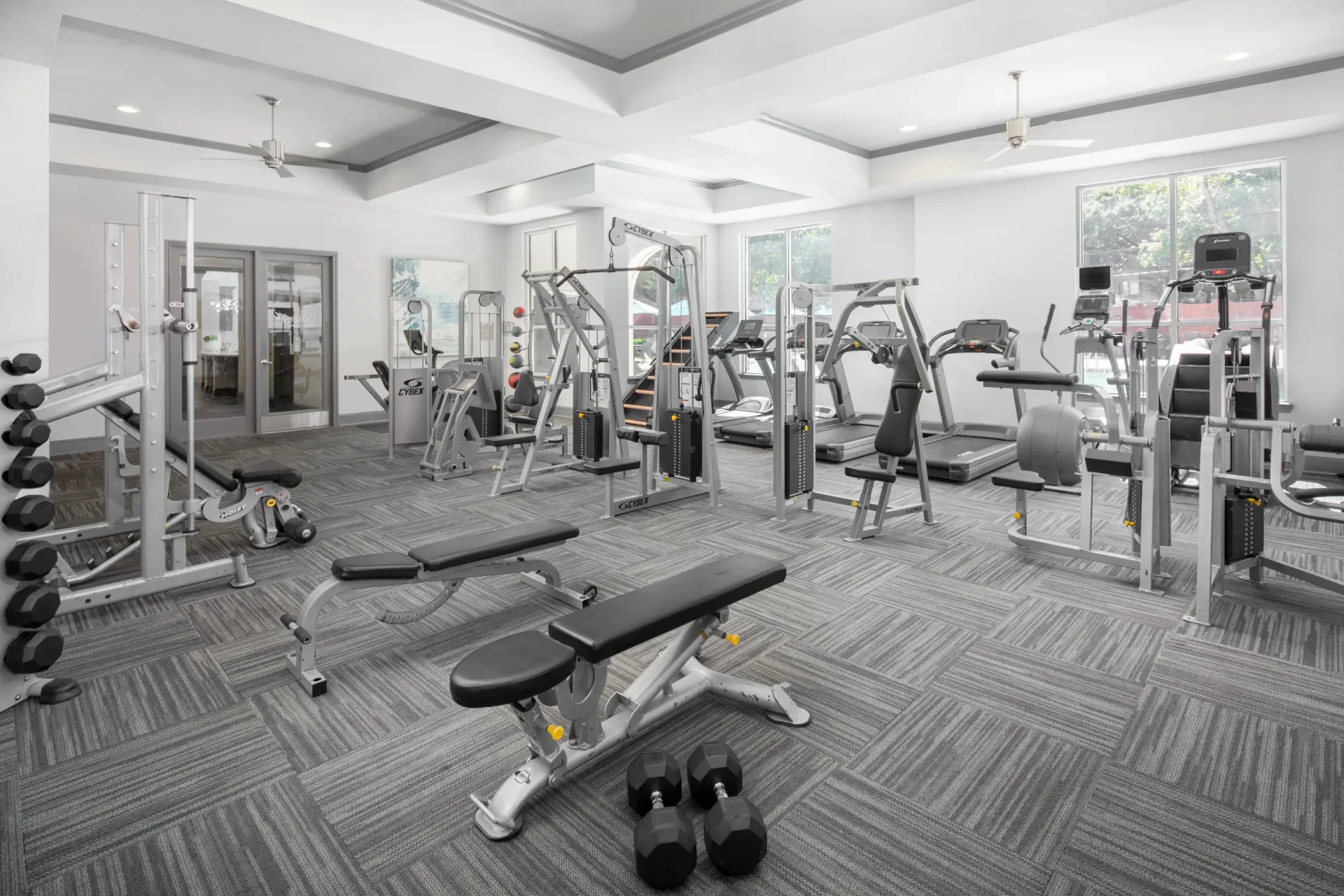 Well-equipped gym with exercise machines and weights