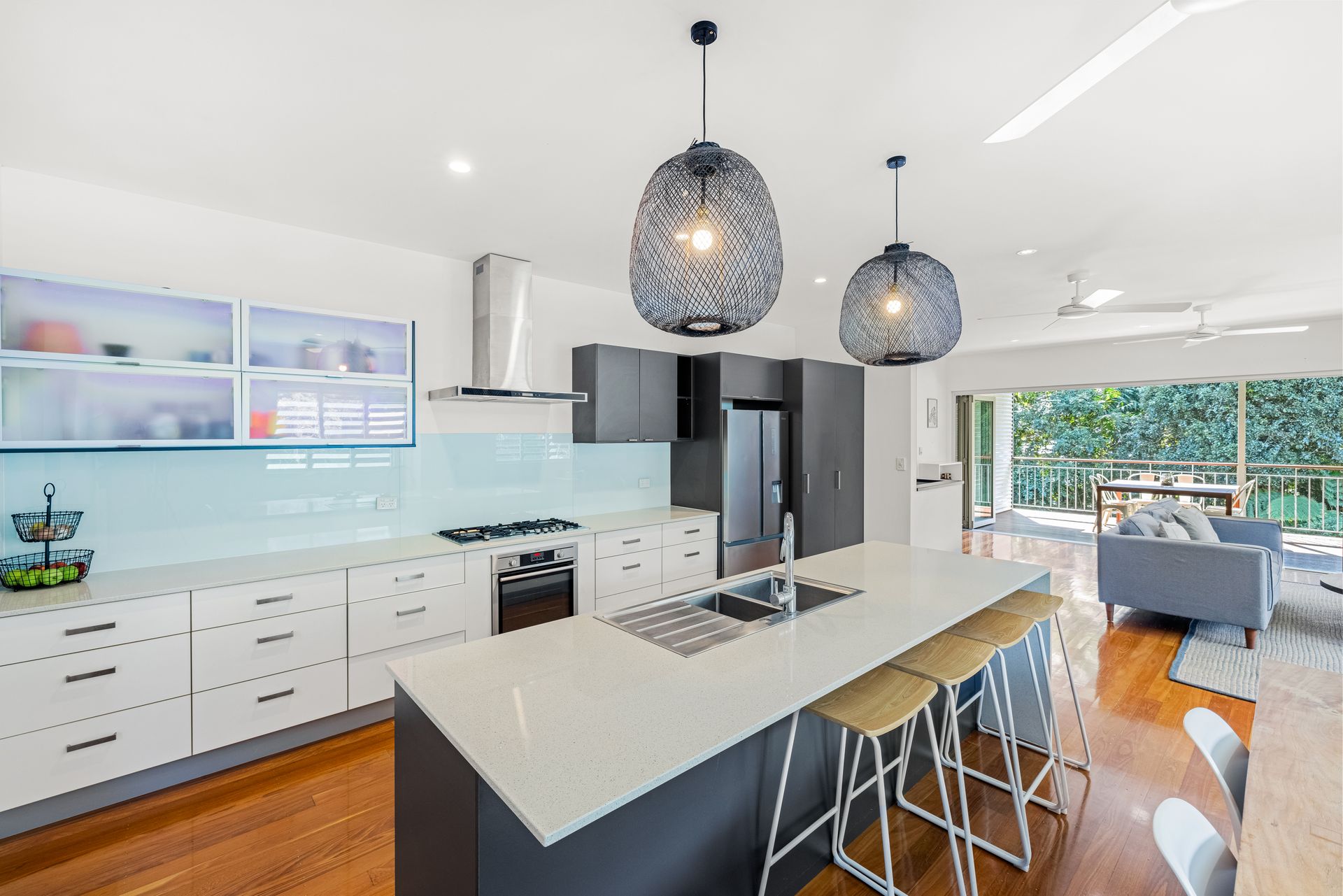 A Kitchen With a Large Island in the Middle of It — MDSR Group in Manunda, QLD