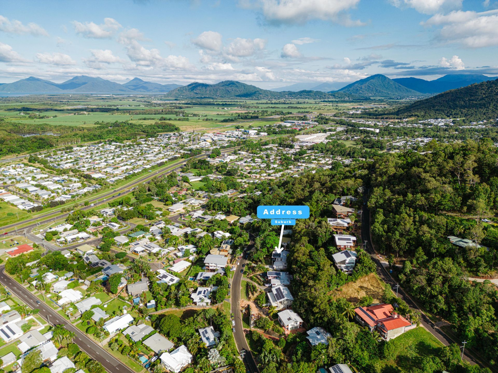 An Aerial View of a Small Town With Mountains in the Background — MDSR Group in Manunda, QLD