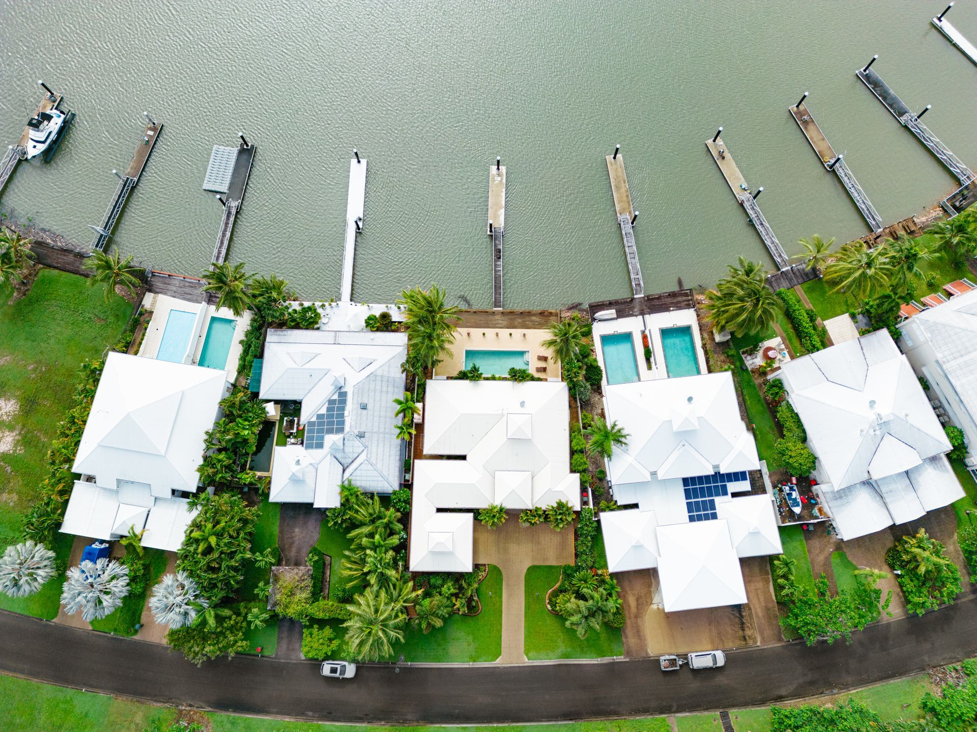 An Aerial View of a Residential Area Near a Body of Water — MDSR Group in Manunda, QLD