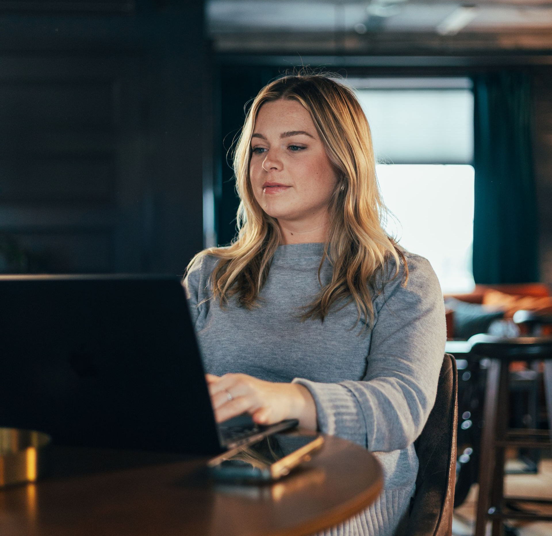 Website on a computer and phone screen: Promoting youth mental health services.