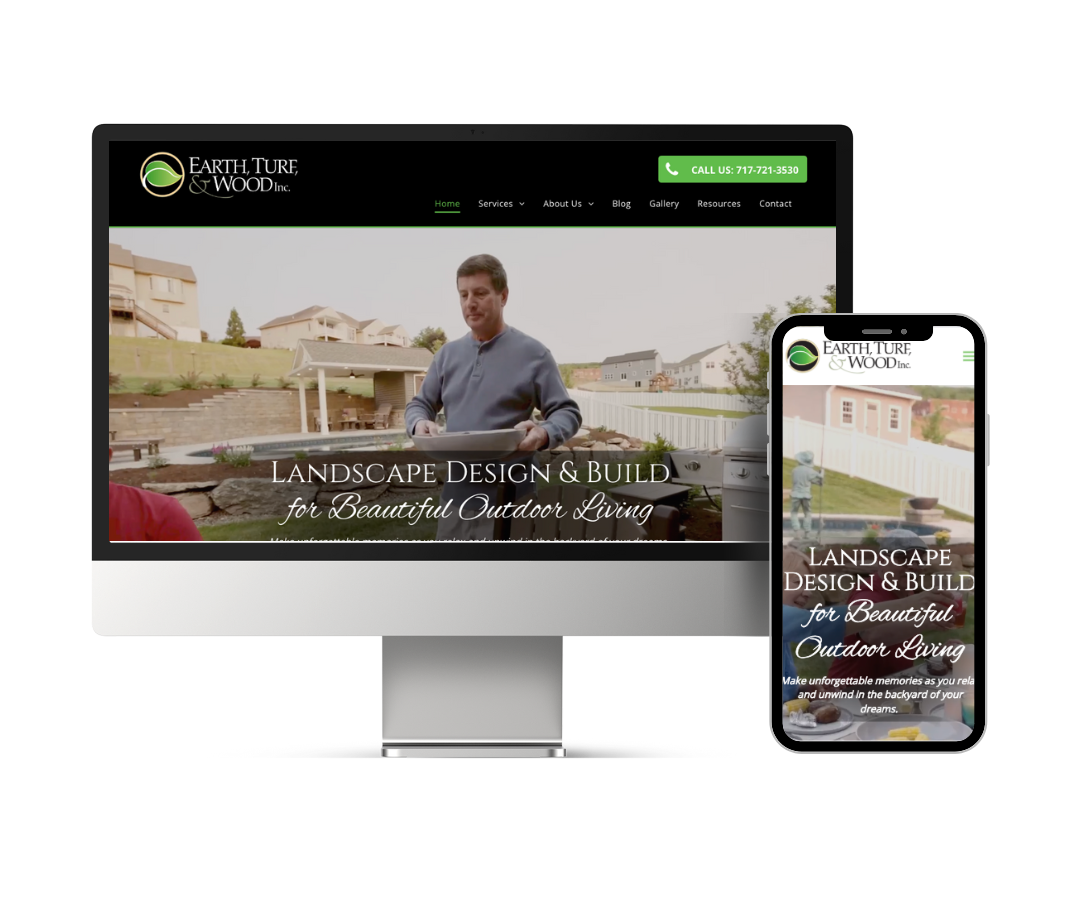 A computer and a cell phone are displaying a landscape design and build website.