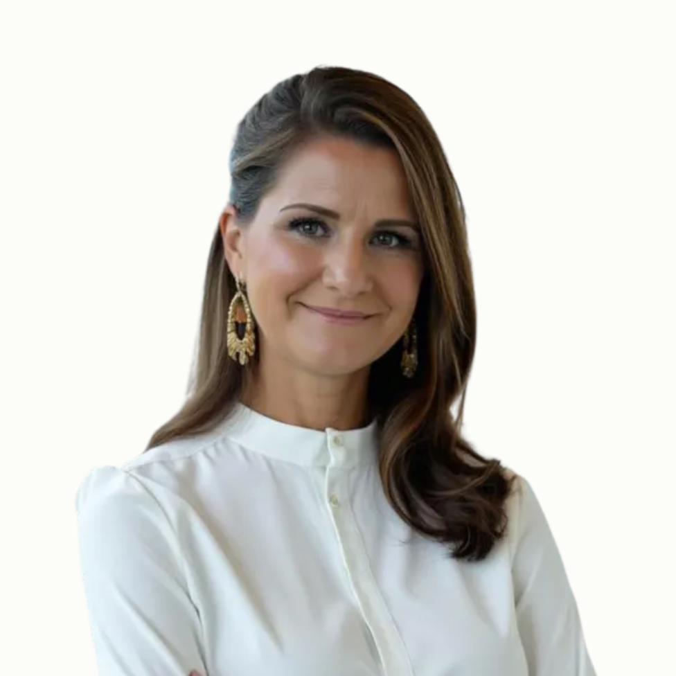 Woman with brown hair wearing a white shirt and gold earrings, smiling.