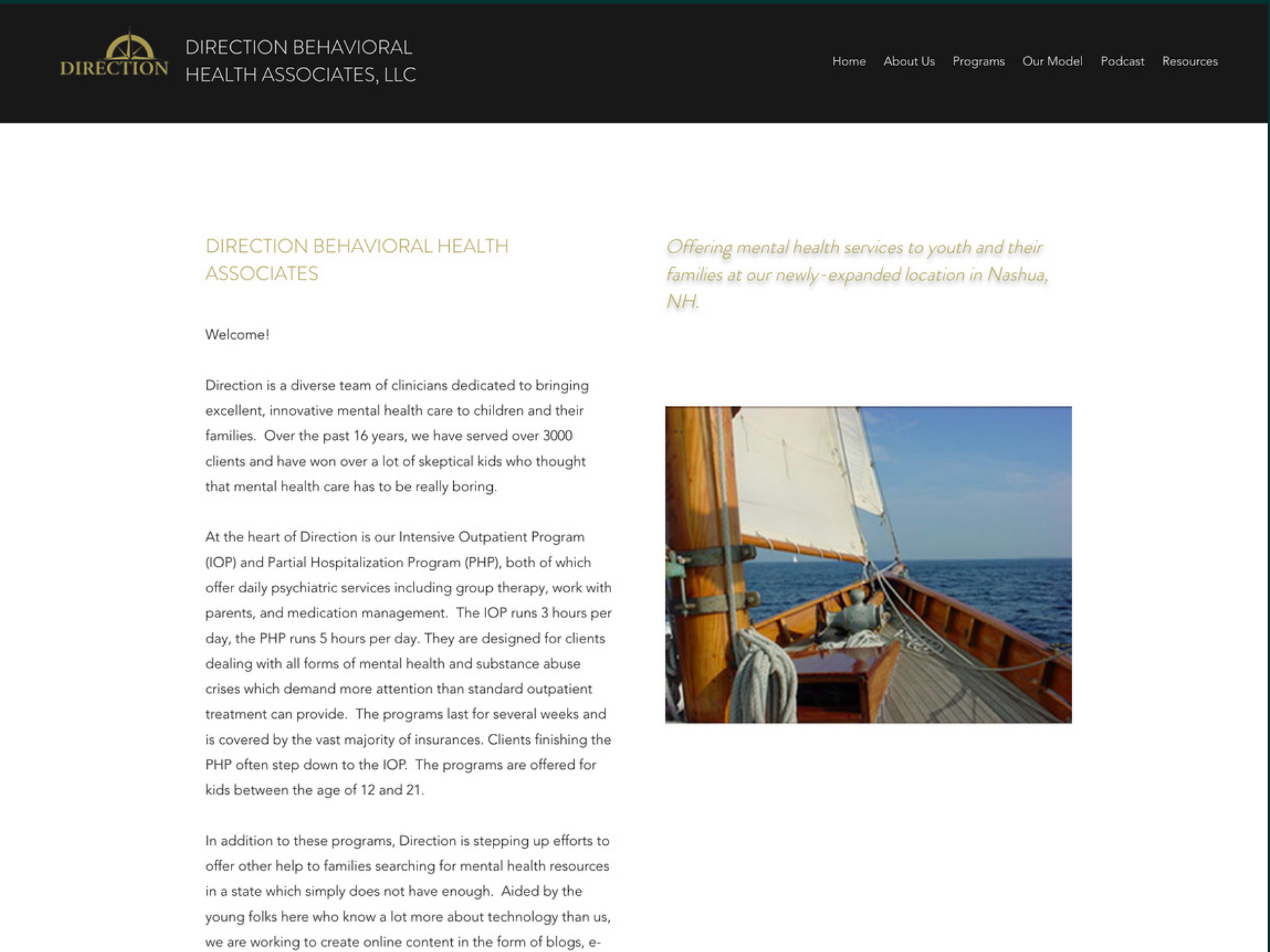 A website homepage with a picture of a sailboat in the ocean.