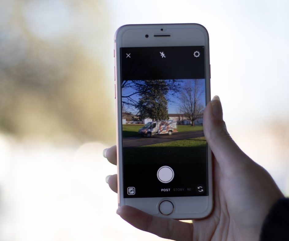 A person is taking a picture with their cell phone