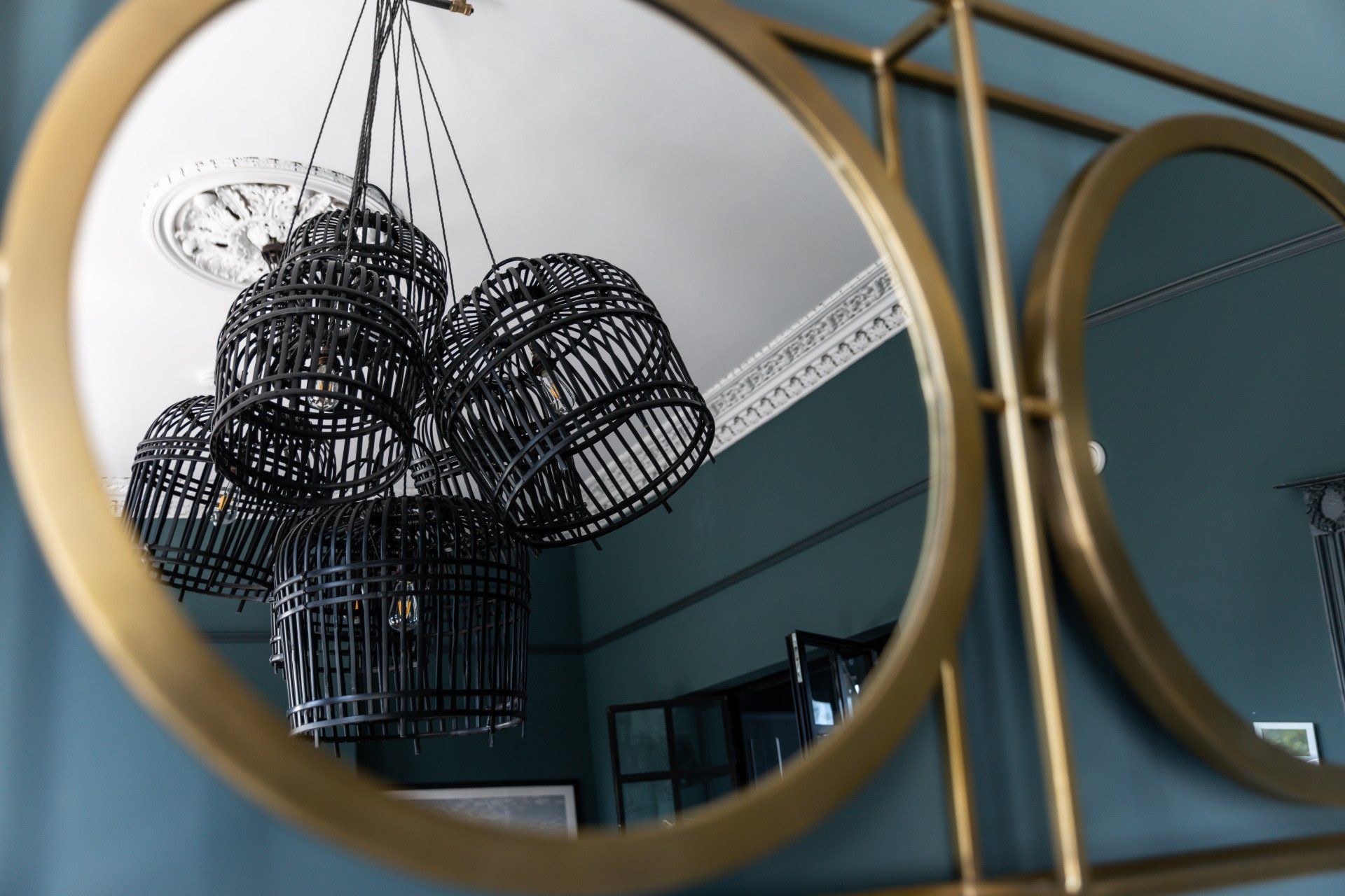 A reflection of a chandelier in a mirror