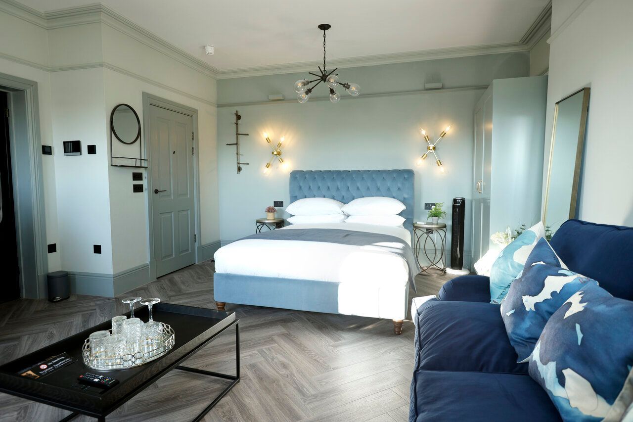 Blue bedroom decor and furniture inside Neptune Apartments Luxury Apartments in Cheltenham