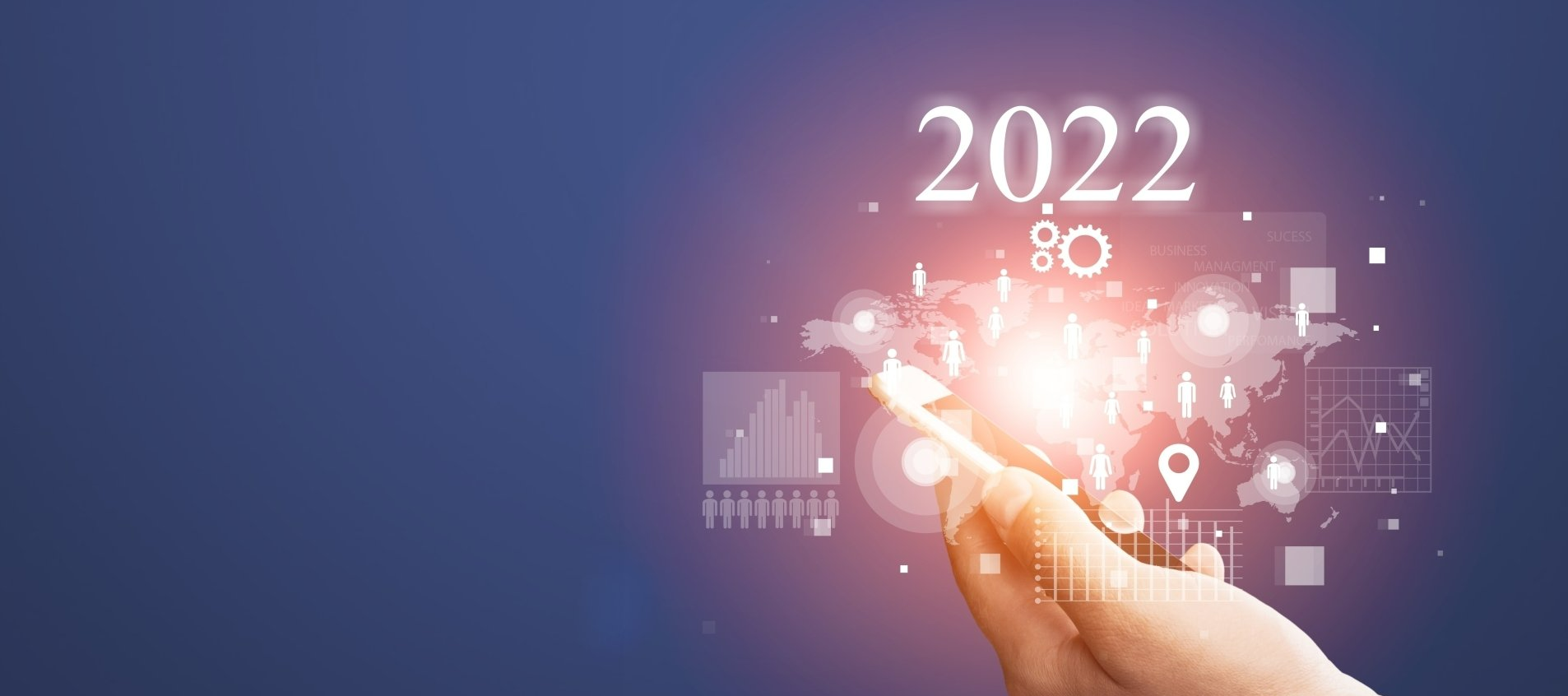 A hand is holding a key in front of a screen that says 2022.