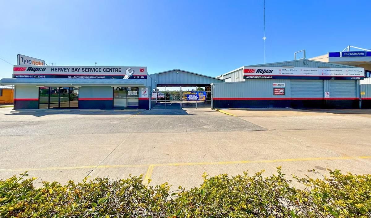 A Large Building With A Parking Lot In Front Of It — Hervey Bay Service Centre in Pialba, QLD