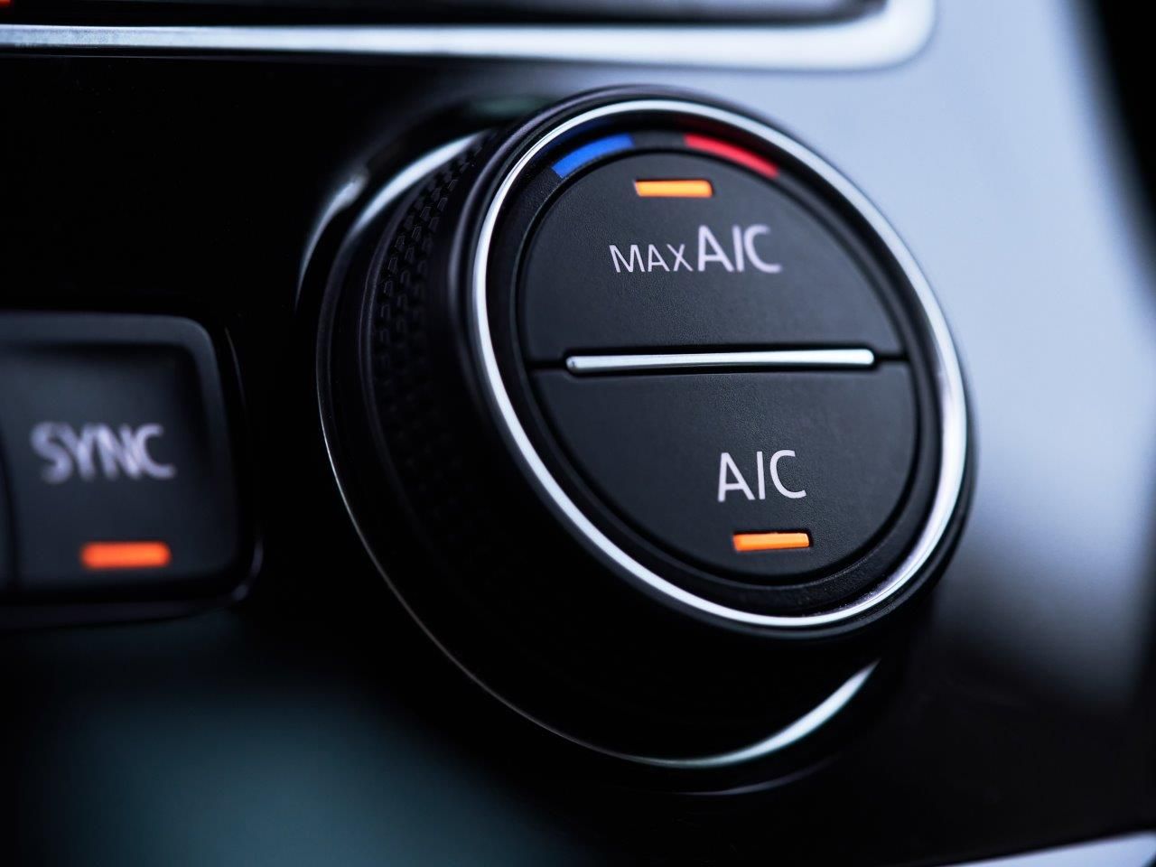 A Person Is Adjusting The Air Conditioner In A Car — Hervey Bay Service Centre in Pialba, QLD