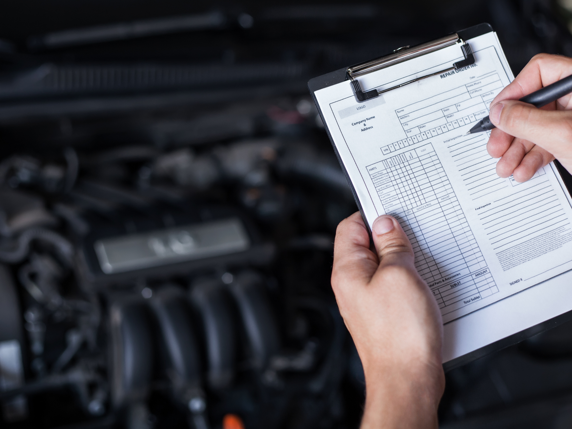 A Red Car Is Parked In Front Of A Tire Shop — Hervey Bay Service Centre in Pialba, QLD