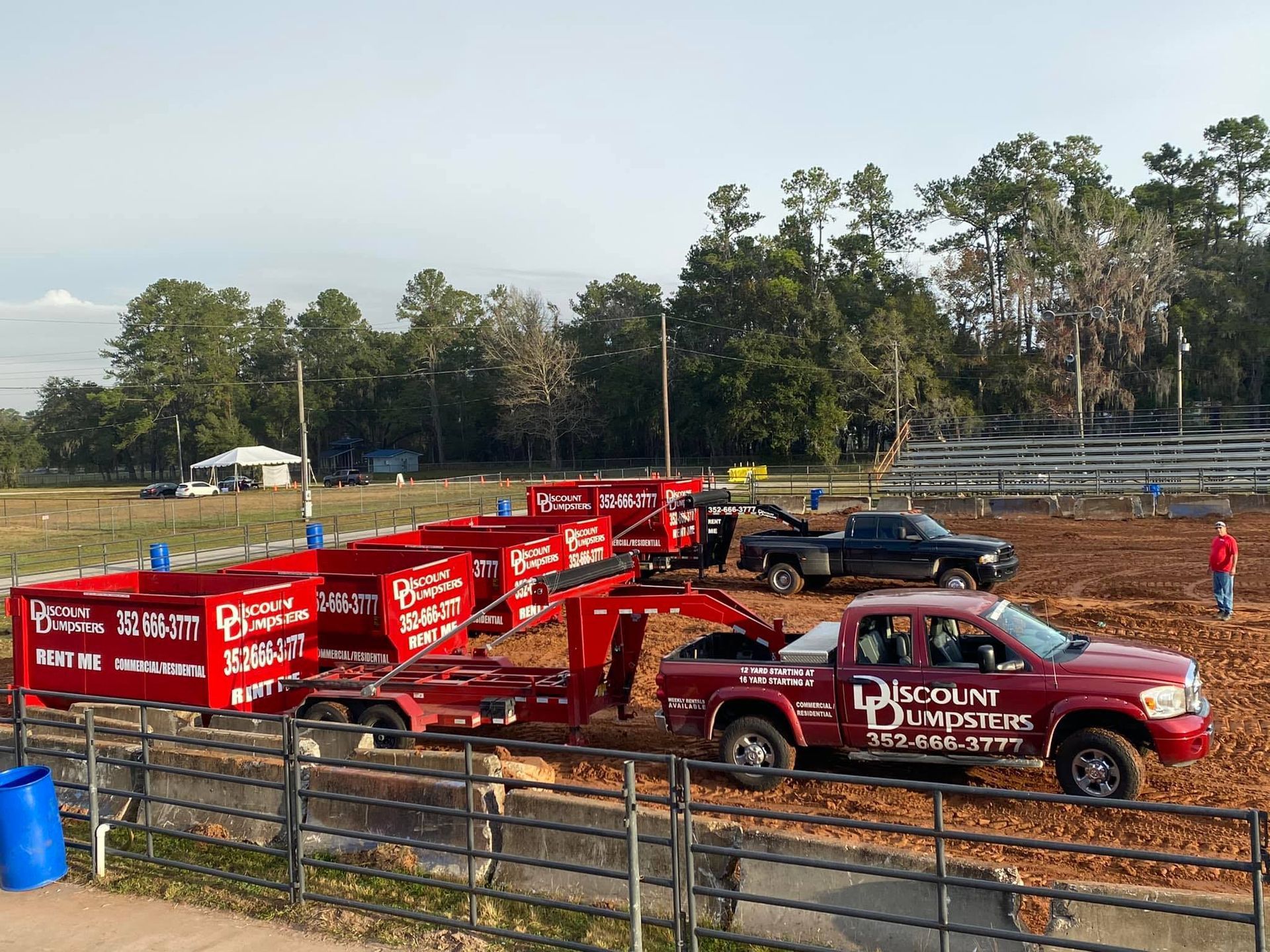A red truck with the word discount dumpster on it