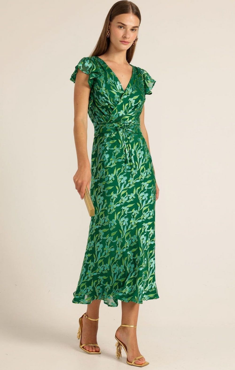 Woman in Green Floral Dress, Holding a Gold Clutch — Onyx Poppy Boutique in Buderim, QLD