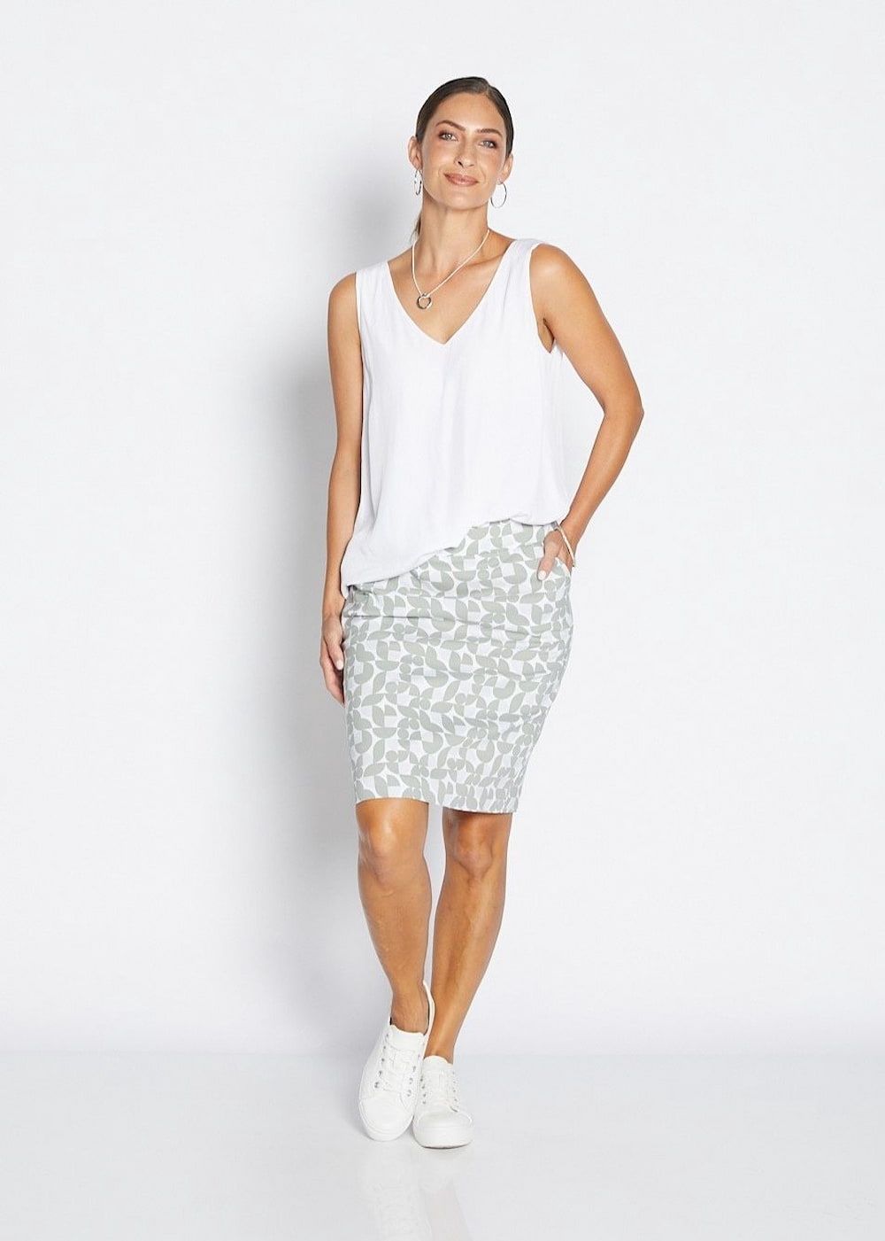 Woman in White Top and Patterned Skirt, Smiling — Onyx Poppy Boutique in Buderim, QLD