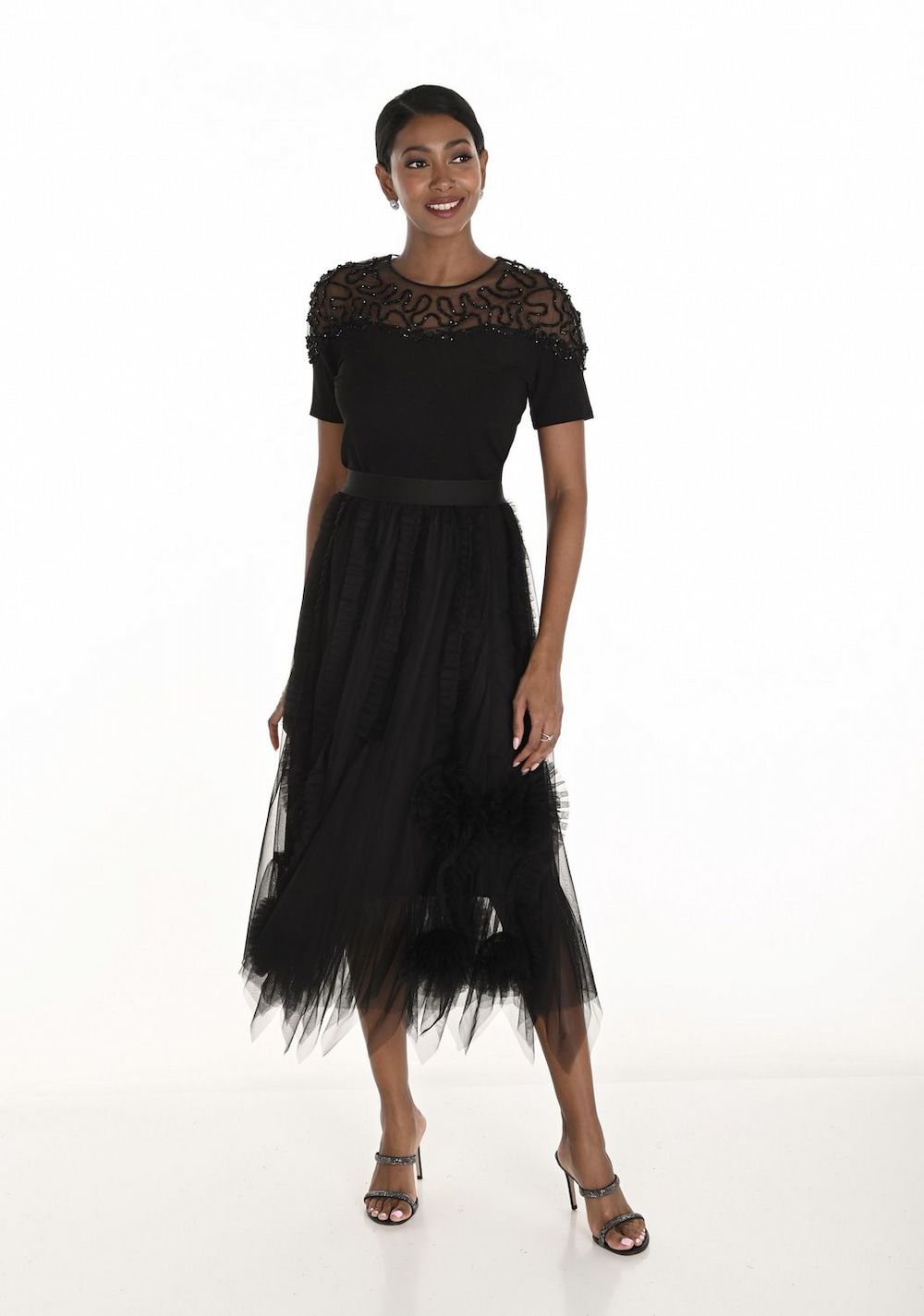 A Woman in a Floral Dress is Standing on a Sidewalk — Onyx Poppy Boutique in Buderim, QLD