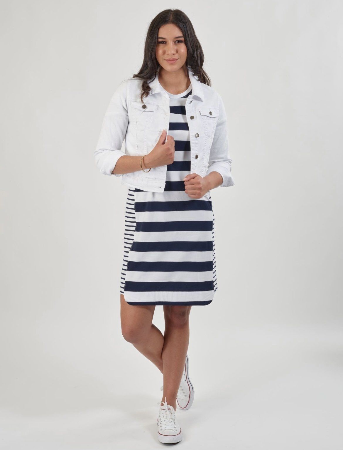 A Woman is Wearing a Striped Dress and a White Denim Jacket — Onyx Poppy Boutique in Buderim, QLD