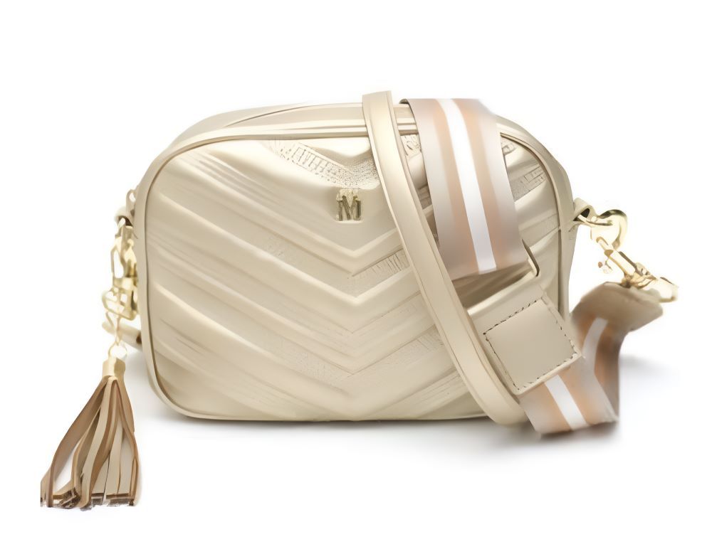 A Gold Purse With a Striped Strap and a Tassel — Onyx Poppy Boutique in Buderim, QLD