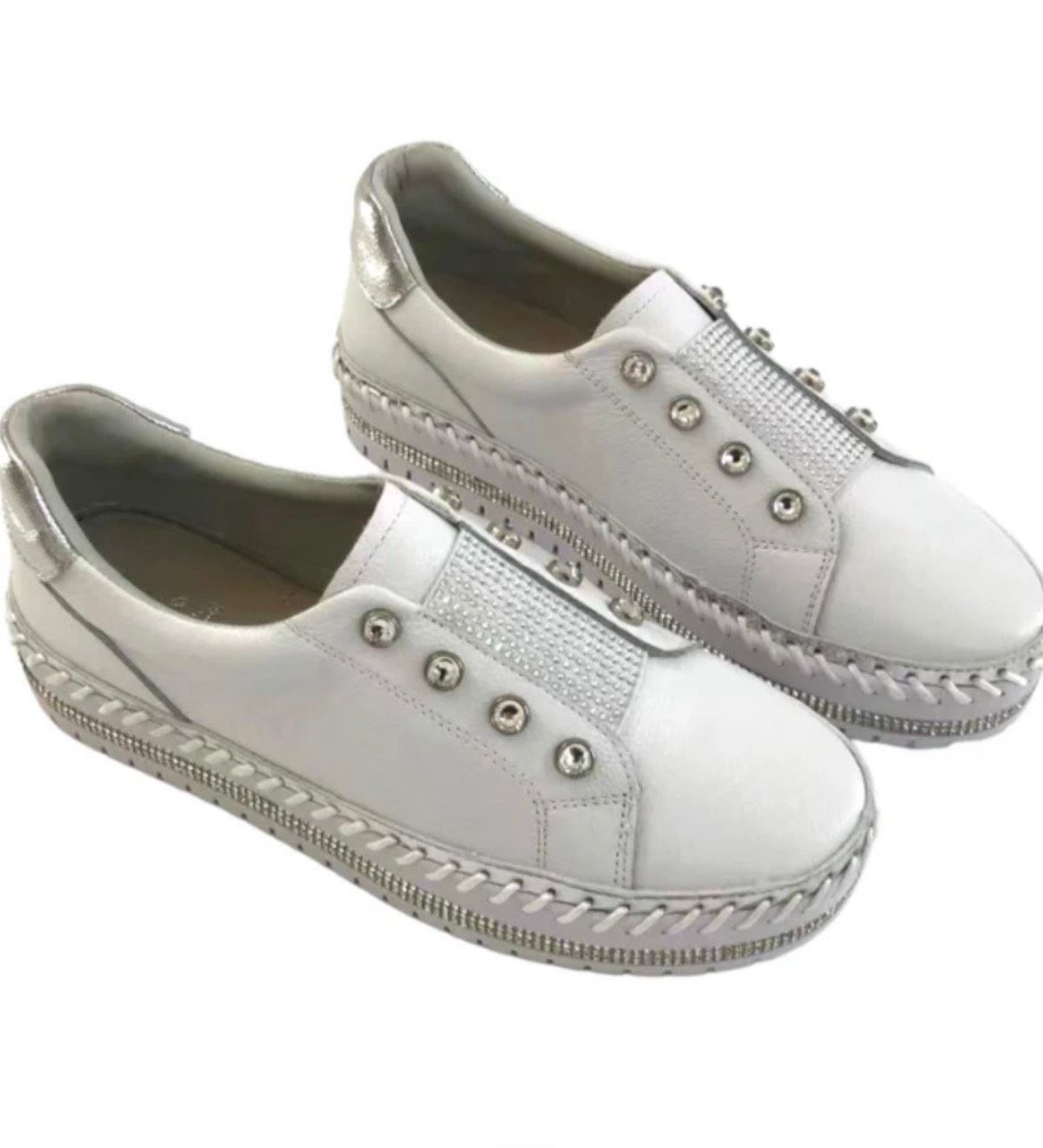 A Pair of White Shoes With Silver Studs on the Side — Onyx Poppy Boutique in Buderim, QLD