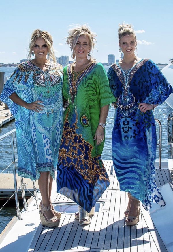 Three Women Are Posing on a Boat — Onyx Poppy Boutique Buderim in Buderim, QLD