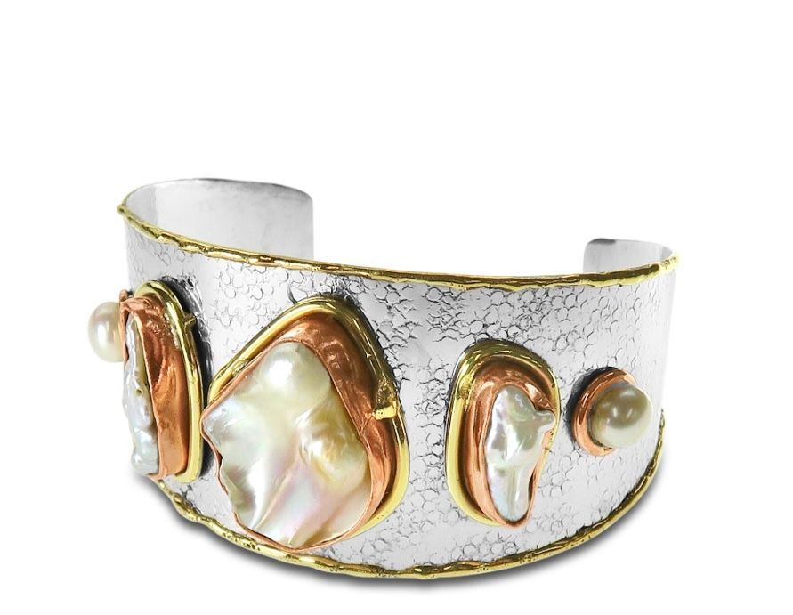 A Gold Purse With a Striped Strap and a Tassel — Onyx Poppy Boutique in Buderim, QLD